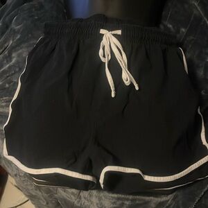 Black and white shorts.